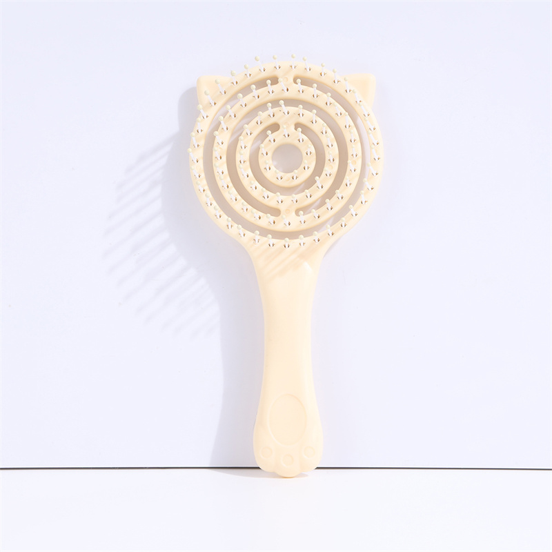 Lattice-shaped hairbrush in pink and yellow colors