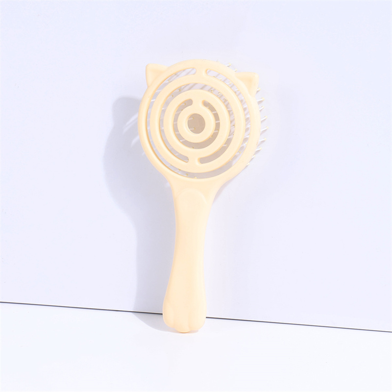 Lattice-shaped hairbrush in pink and yellow colors